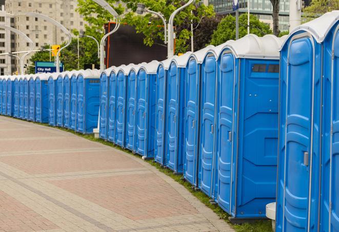 a line of portable restrooms set up for a wedding or special event, ensuring guests have access to comfortable and clean facilities throughout the duration of the celebration in Belmont